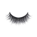 A single strip of black false eyelashes with mink-like, long, wispy, voluminous fibers arranged in a natural curve on white.
