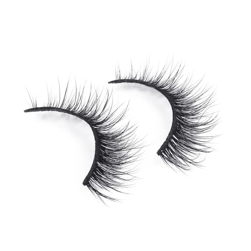 Dramatic, black, wispy false eyelashes with a natural curve and sultry allure, displayed on a white background.