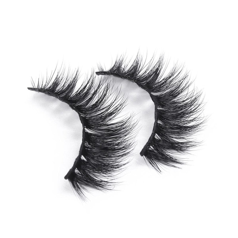 Two black, voluminous mink-effect false eyelashes with a dramatic, wispy texture are displayed on a white background.
