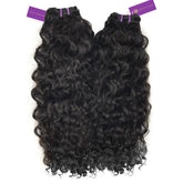 Two bundles of long, curly black hair extensions with purple tags at the top are side by side on a white background. Perfect for volume and style.