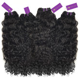 Four bundles of luxurious, long, black, curly hair extensions with purple "Perfect Locks" tags lie side by side on white.