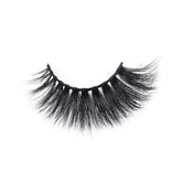 A single, curved strip of thick, black faux mink eyelashes with long, wispy fibers rests isolated on a white background.