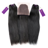 Three bundles of straight black hair extensions with purple tags and a matching lace closure are neatly arranged on a white background.