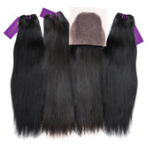 Four bundles of straight black human hair extensions side by side, each tied with purple bands and tags; lace closure above center.