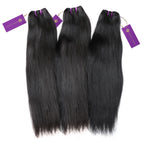Three bundles of sleek, straight black hair extensions with purple tags are neatly arranged side by side on a white background.
