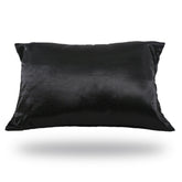 A purple Perfect Locks Satin-Silk Pillowcase rests against a white background, appearing to float—ideal for protecting hair and reducing friction.