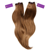 Two bundles of long, straight ombre hair extensions with dark roots, each secured with a purple band and a Perfect Locks tag.