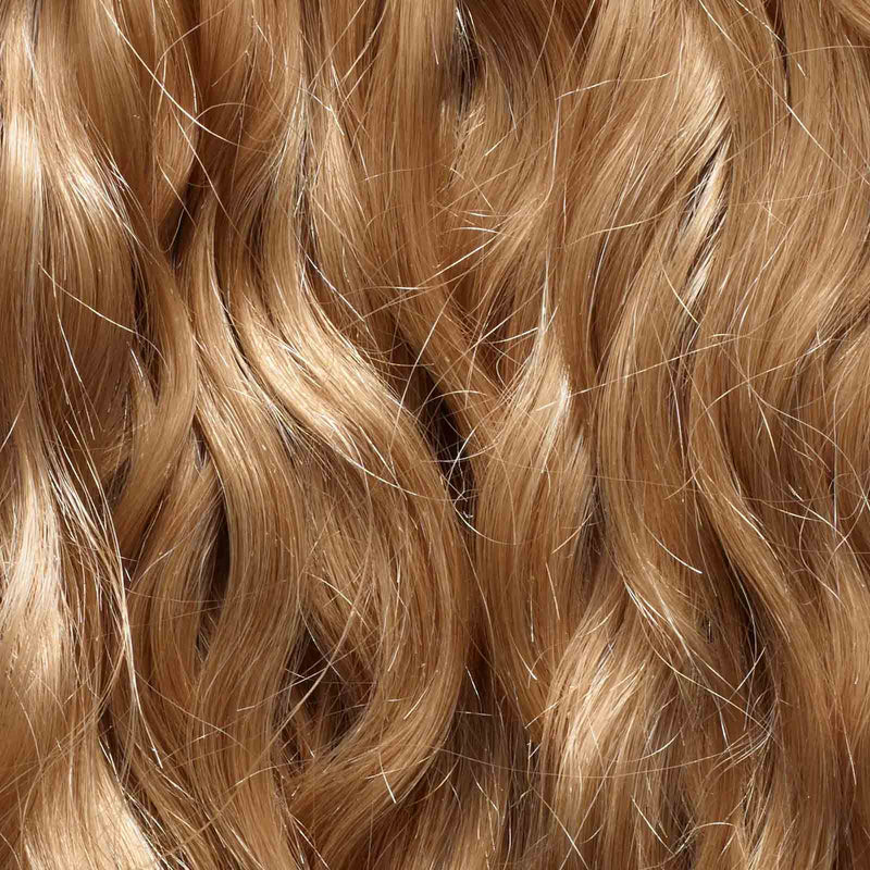 Close-up of long, wavy, light brown or blonde hair with a shiny texture and natural highlights.