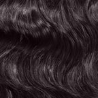 Close-up of dark, wavy hair with a shiny texture, featuring natural waves and highlights throughout for a radiant look.